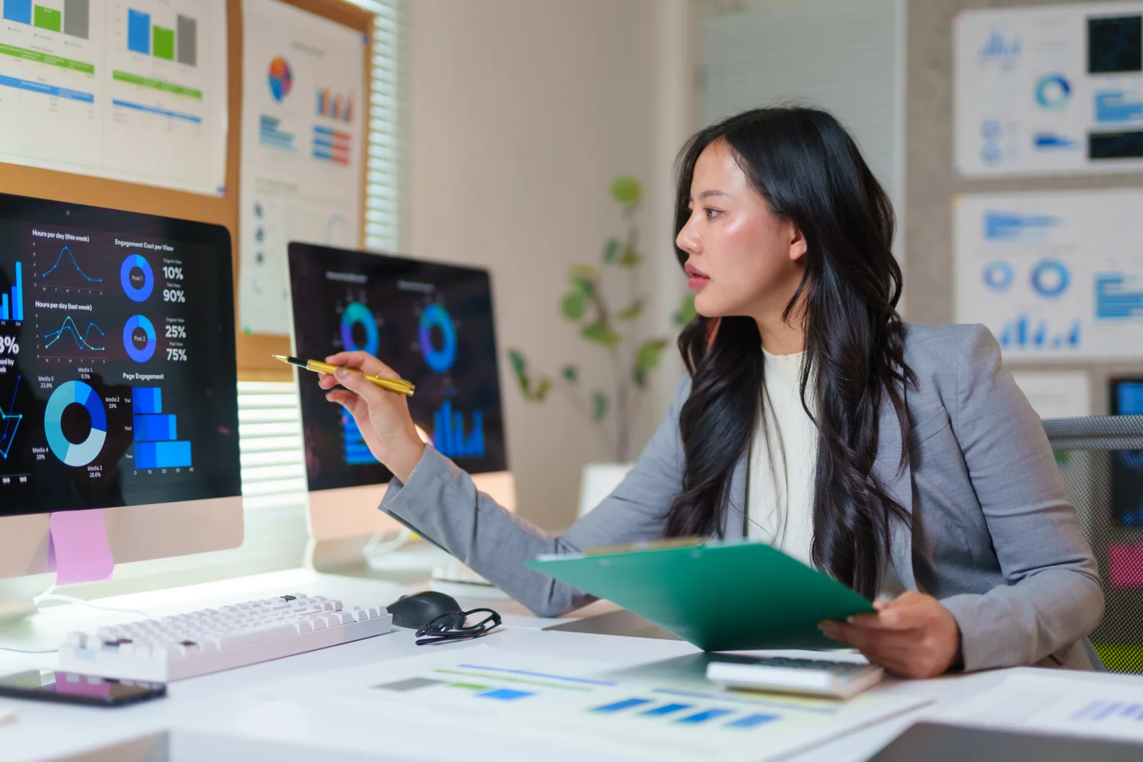 Business analyst reviewing digital dashboards